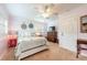 Cozy bedroom features nautical decor, ceiling fan, and comfortable furnishings at 936 N Baker St, Mount Dora, FL 32757