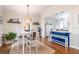 Charming dining area adjacent to a modern kitchen at 936 N Baker St, Mount Dora, FL 32757