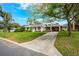 Exterior view of home showcasing its well-manicured lawn and attractive facade at 936 N Baker St, Mount Dora, FL 32757