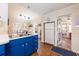 Well-lit kitchen with stainless steel appliances and wooden floors at 936 N Baker St, Mount Dora, FL 32757