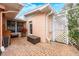 Cozy brick patio enclosed by a fence and featuring an outdoor storage box at 936 N Baker St, Mount Dora, FL 32757