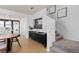 Dining area with staircase and modern decor leading to an open-concept layout at 10246 Hadley St, Orlando, FL 32829