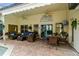 Inviting covered patio features comfortable seating, ceiling fans, and outdoor dining at 1154 Seneca Trl, St Cloud, FL 34772