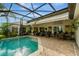 Relaxing screened in pool area with an outdoor living space for entertaining at 1154 Seneca Trl, St Cloud, FL 34772