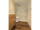 Bathroom featuring a shower with marble tiling, wooden cabinets and a toilet at 116 Crown Oaks Way # 116, Longwood, FL 32779