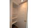 Linen closet with white shelves, storage space on the door and baseboard at 116 Crown Oaks Way # 116, Longwood, FL 32779