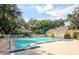 A refreshing community pool with ample deck space, a gazebo, and lush landscaping for relaxation at 116 Crown Oaks Way # 116, Longwood, FL 32779