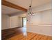 Open concept dining area with hardwood floors, a beam ceiling, and lots of natural light at 116 Crown Oaks Way # 116, Longwood, FL 32779