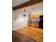 Bright kitchen featuring an eat-in space, wooden cabinetry, and a beamed ceiling at 116 Crown Oaks Way # 116, Longwood, FL 32779