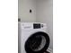 Close up of the white washing machine at 116 Crown Oaks Way # 116, Longwood, FL 32779