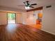 Open-concept living room with new flooring and sliding glass doors at 116 Crown Oaks Way # 116, Longwood, FL 32779