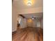 Living room featuring hard wood flooring, a fan and a view of the kitchen at 116 Crown Oaks Way # 116, Longwood, FL 32779