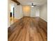 Living room featuring hard wood flooring, a fan and a view of the kitchen at 116 Crown Oaks Way # 116, Longwood, FL 32779