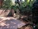 Relaxing wooden patio with lush foliage, offering privacy and a tranquil outdoor space at 116 Crown Oaks Way # 116, Longwood, FL 32779