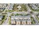 Aerial view of townhomes with a green marker for location with green space and a roundabout at 12024 Sonnet Ave, Orlando, FL 32832