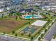 Aerial view of neighborhood amenities including community pool, playground, and basketball court at 12024 Sonnet Ave, Orlando, FL 32832