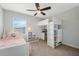 Cozy bedroom featuring a loft bed, desk and plenty of storage at 12024 Sonnet Ave, Orlando, FL 32832