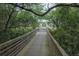 A wooden bridge pathway over green space at 12024 Sonnet Ave, Orlando, FL 32832