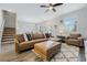 Inviting living room with ample seating, neutral tones, and a staircase in view at 12024 Sonnet Ave, Orlando, FL 32832