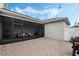 A charming covered patio with hanging chair, outdoor furniture, and a brick-paved floor offers a relaxing outdoor space at 12024 Sonnet Ave, Orlando, FL 32832