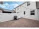 A beautiful backyard patio with brick pavers and string lights offers an ideal outdoor entertaining space at 12024 Sonnet Ave, Orlando, FL 32832