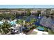 Aerial view of community pool, lake with fountain, and recreation area at 1244 Romani Ave # 1244, Davenport, FL 33896