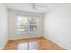 Bedroom with wood floors, a ceiling fan, and a window with blinds at 1244 Romani Ave # 1244, Davenport, FL 33896