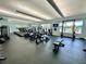 Community gym equipped with modern treadmills and fitness machines overlooking the pool area at 1244 Romani Ave # 1244, Davenport, FL 33896