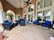 Outdoor lounge area with comfortable seating, ceiling fans and tiled flooring at 1244 Romani Ave # 1244, Davenport, FL 33896