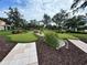 Manicured putting green with statues, decorative grasses, and stone pathways at 1244 Romani Ave # 1244, Davenport, FL 33896