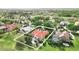 Aerial view of home with pool, manicured lawn, and mature trees in a residential neighborhood at 12820 Butler Bay Ct, Windermere, FL 34786