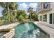 Resort style backyard with sparkling pool, spa, and lush tropical landscaping, perfect for relaxing or entertaining at 12820 Butler Bay Ct, Windermere, FL 34786