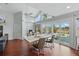 Bright dining area with vaulted ceilings, large windows, and a view of the pool and backyard at 12820 Butler Bay Ct, Windermere, FL 34786