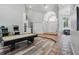 Bright foyer with tile flooring, high ceilings, and a pool table in the adjacent game room at 12820 Butler Bay Ct, Windermere, FL 34786