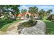 Impressive home exterior with manicured landscaping and a lengthy driveway leading to the entrance at 12820 Butler Bay Ct, Windermere, FL 34786