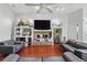 Cozy living room with a fireplace, TV, and comfortable seating, perfect for relaxation at 12820 Butler Bay Ct, Windermere, FL 34786