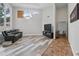 Bright living room with hardwood floors, a comfortable couch, and a large window for ample lighting at 12820 Butler Bay Ct, Windermere, FL 34786