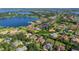 Stunning aerial view showcasing a lakeside community with beautiful homes, lush greenery and serene lake views at 12860 Jacob Grace Ct, Windermere, FL 34786