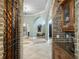 Elegant foyer featuring arched doorways, neutral tile flooring, and a glimpse of the home's open layout at 12860 Jacob Grace Ct, Windermere, FL 34786