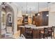 Gourmet kitchen with high-end appliances, granite countertops, custom cabinets, and a large island at 12860 Jacob Grace Ct, Windermere, FL 34786
