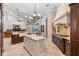Spacious kitchen with stainless steel appliances, a large island, and view into a fireplace living room at 12860 Jacob Grace Ct, Windermere, FL 34786