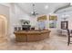 Bright living room with fireplace, tile floor, ceiling fan, and doorway to the outside at 12860 Jacob Grace Ct, Windermere, FL 34786