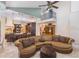 Open concept living room with kitchen, high ceilings, and large sectional sofa at 12860 Jacob Grace Ct, Windermere, FL 34786