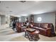 Living room featuring two leather couches, arm chair, and recumbent bike at 12860 Jacob Grace Ct, Windermere, FL 34786