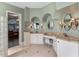 Spacious main bathroom with granite countertops, double sinks, and tiled floors at 12860 Jacob Grace Ct, Windermere, FL 34786