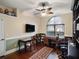 Cozy office with large window, built-in shelving, and hardwood floors at 12860 Jacob Grace Ct, Windermere, FL 34786