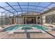 A stunning pool and spa area with a screened-in enclosure for year-round enjoyment at 12860 Jacob Grace Ct, Windermere, FL 34786