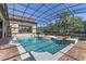 A gorgeous pool with a spa, surrounded by brick pavers and a screened-in enclosure at 12860 Jacob Grace Ct, Windermere, FL 34786