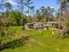 Aerial view of home showcasing the large lot and mature trees at 13128 Devonshire Rd, Orlando, FL 32832