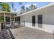 Wooden deck with access to the screened porch and backyard; great for entertaining at 13128 Devonshire Rd, Orlando, FL 32832